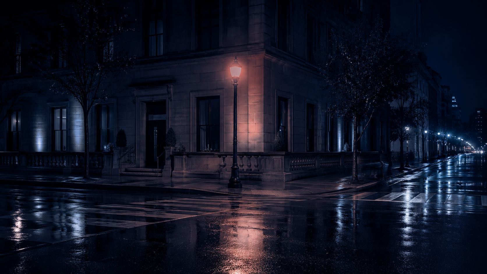 F Street NW in Foggy Bottom at night, wet pavement under street lamps