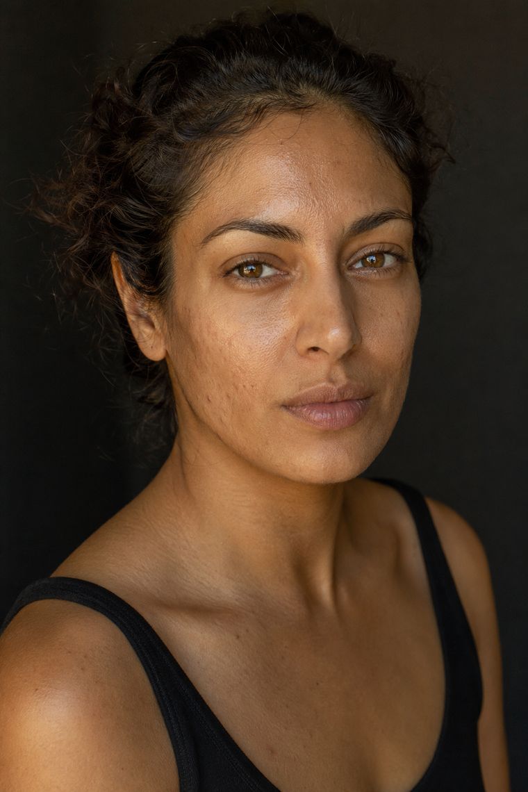 Natural light portrait showing medium skin with visible texture and pigment
