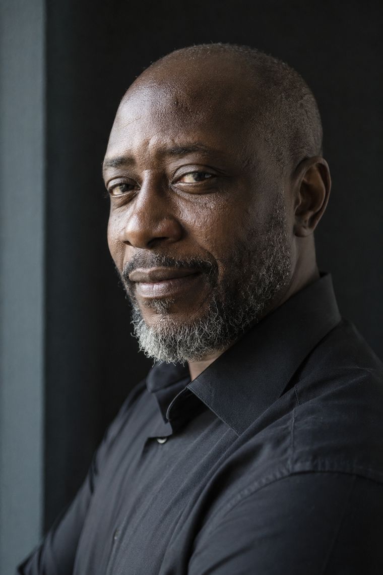 Natural light portrait of a man with deep skin and visible texture